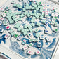 Oh My Mahjong Birdie  tile set on Amazon instructional tablecloth with white acrylic  rack and pusher set