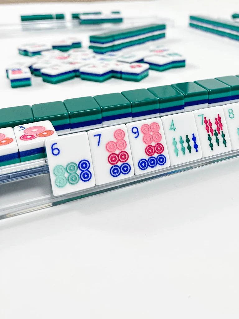 Oh My Mahjong shangri la  tile set face design side layers player face design collection poolside on mat with shufflers on rack and pusher